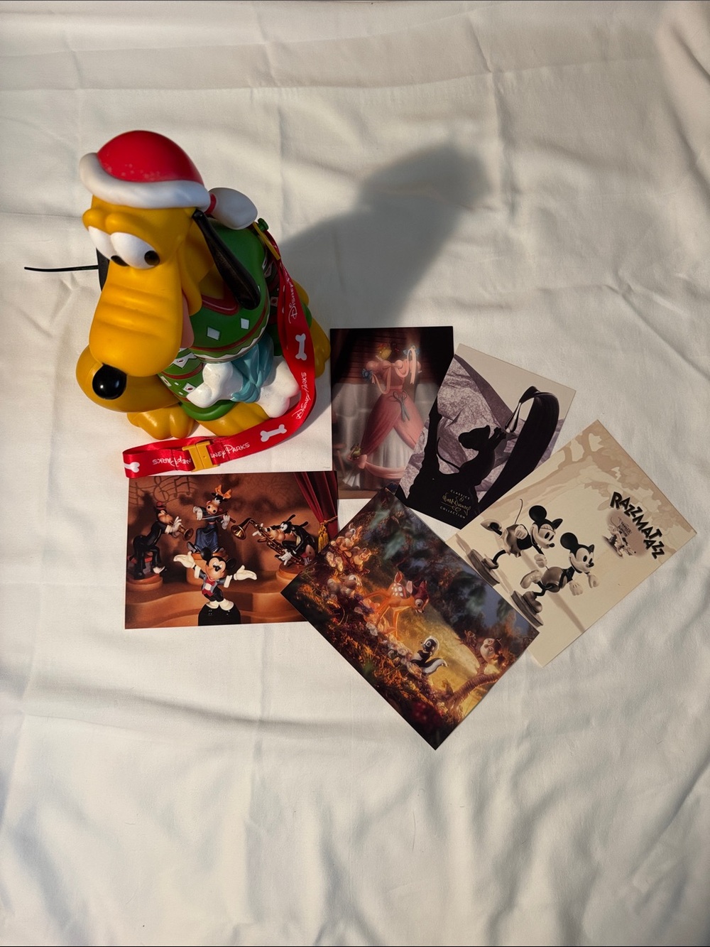Disney Pluto Holiday popcorn bucket and Collectible Postcards